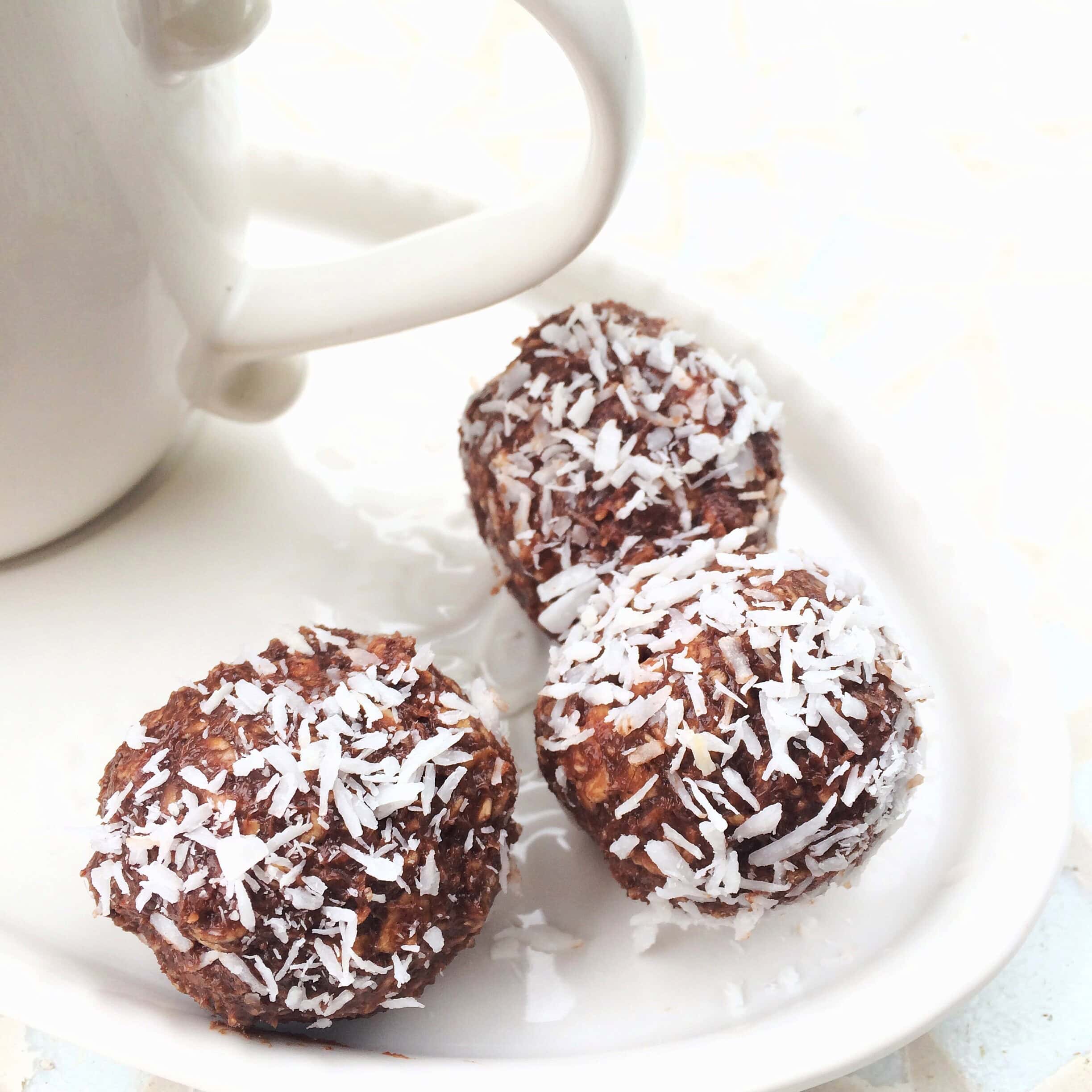 Delicious vegan chocolate coconut truffles with shredded coconut topping.